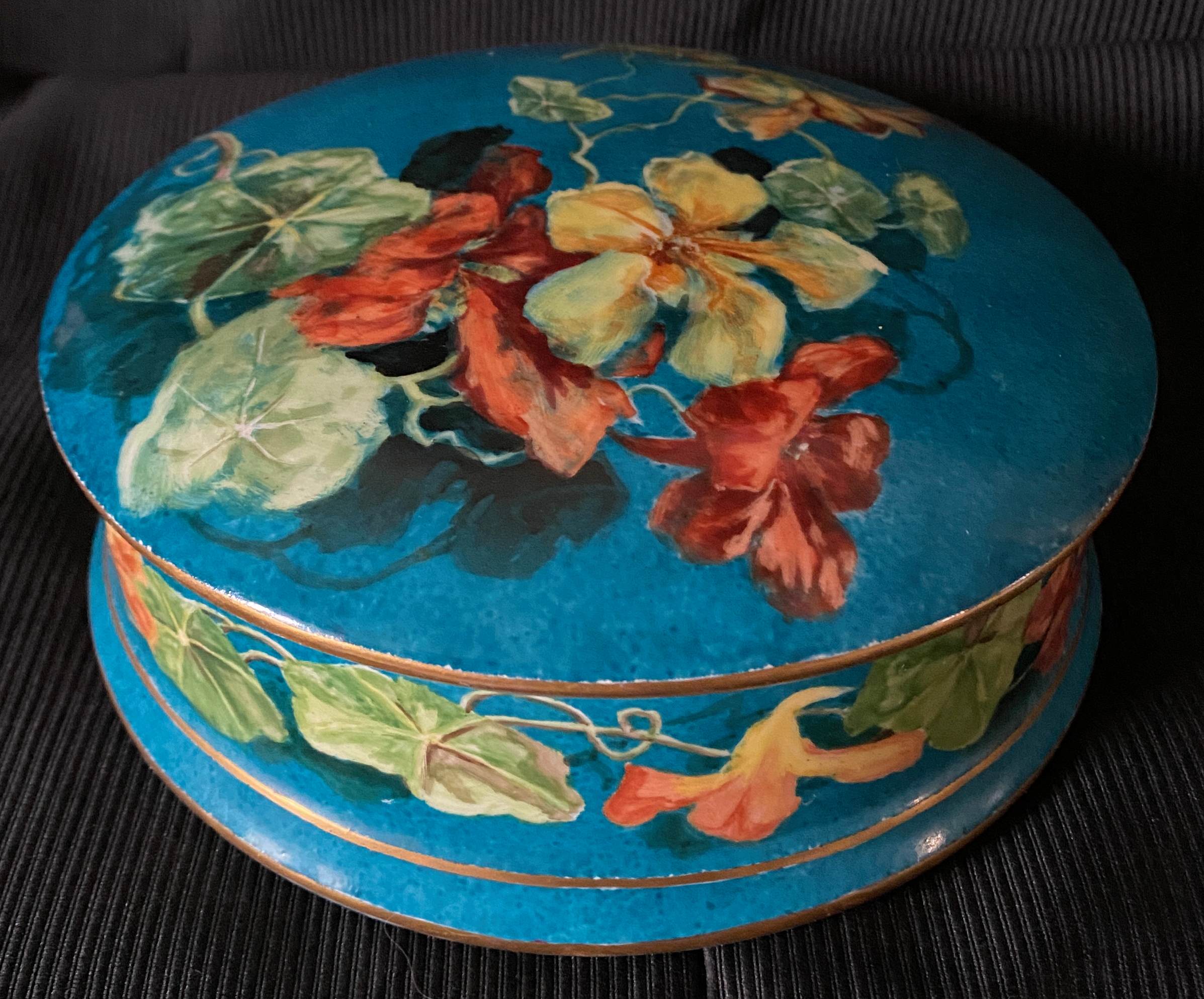 Antique porcelain candy box with floral motifs