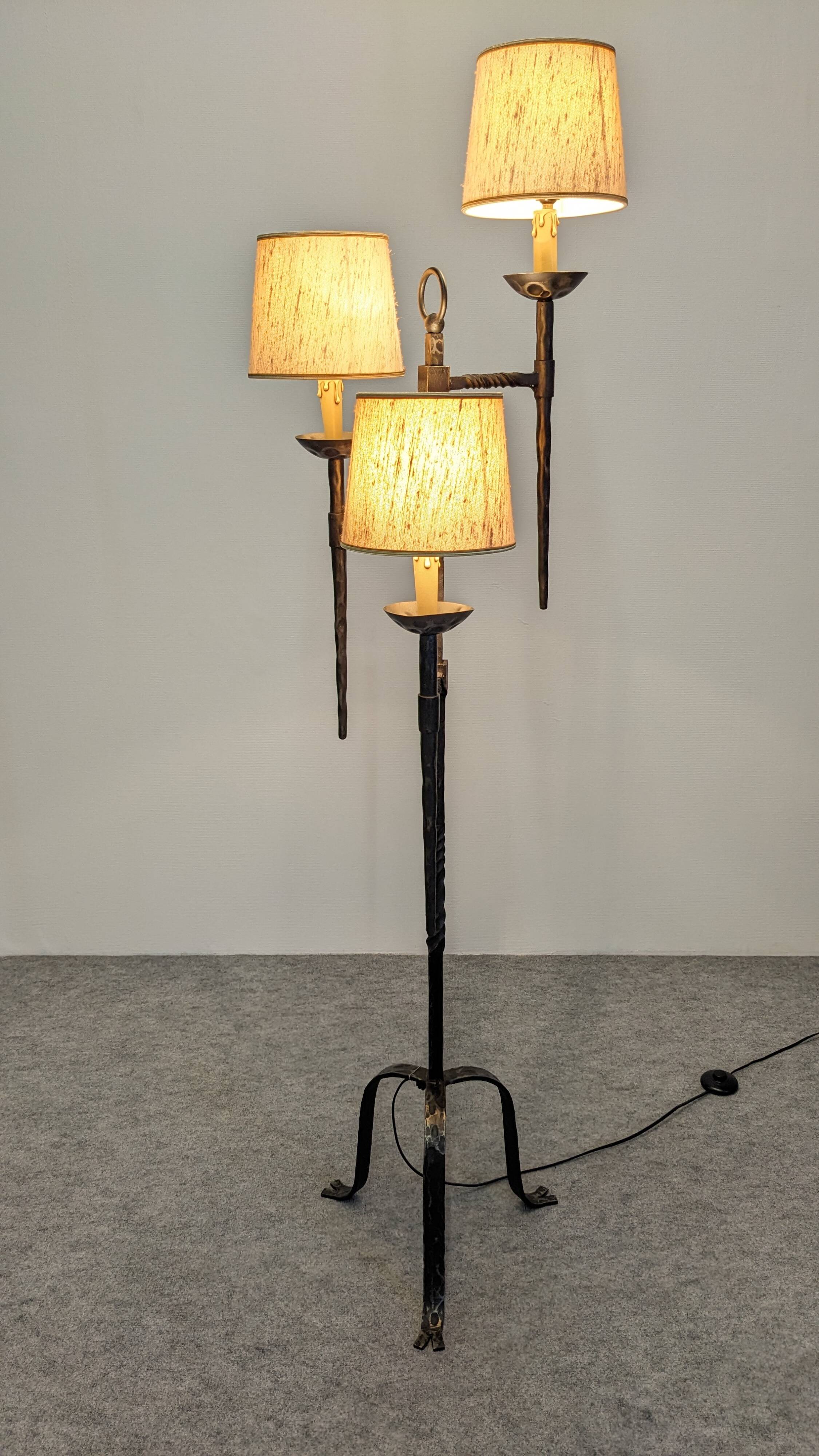 Brutalist tripod floor lamp with 3 lights in wrought iron, France circa 1950.