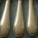 Set of 12 cheese or fruit knives with silver metal handles.
