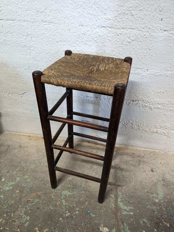 High wooden stool and straw