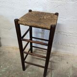 High wooden stool and straw