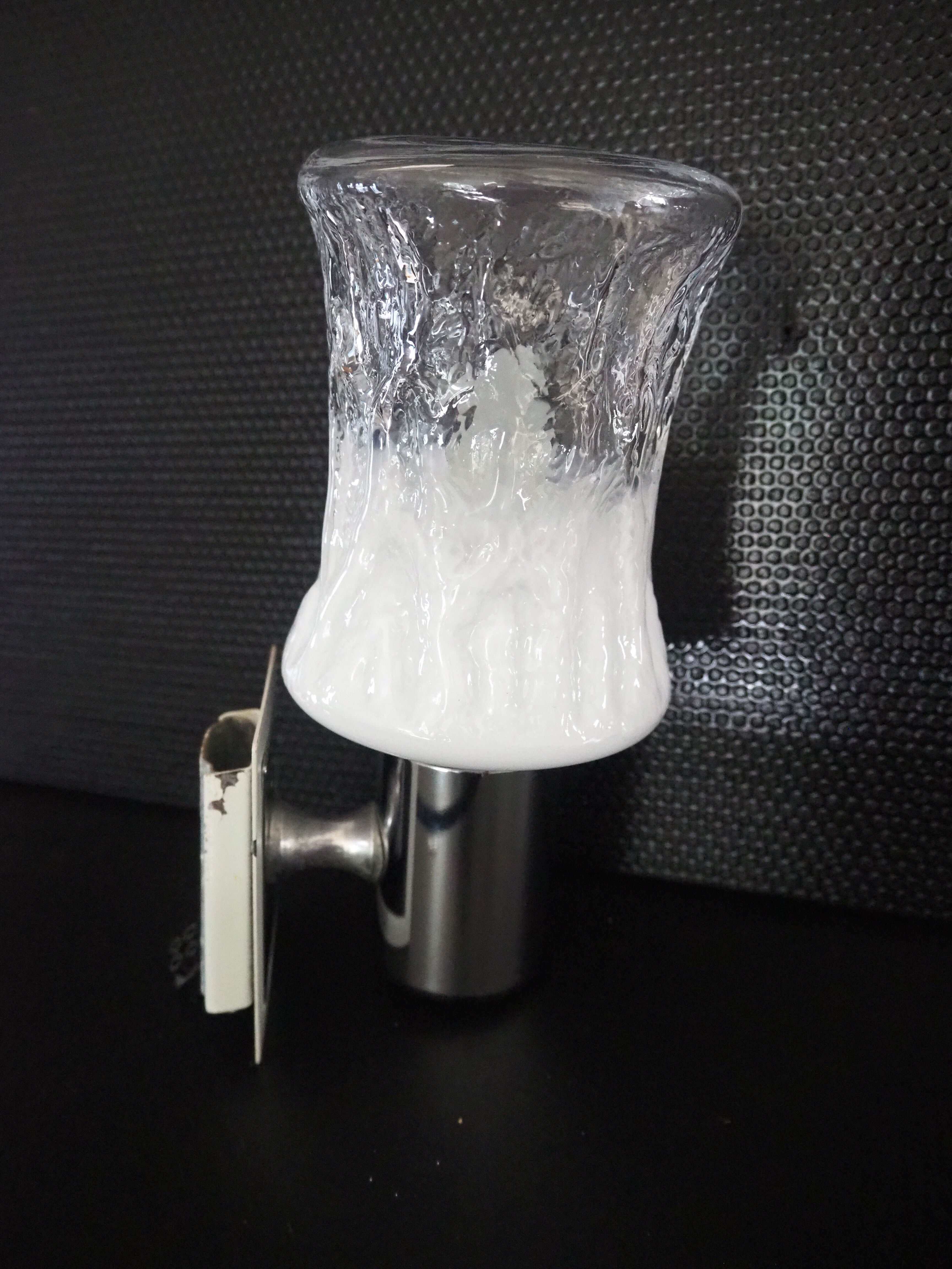 Torch type wall lamp in transparent and white glass