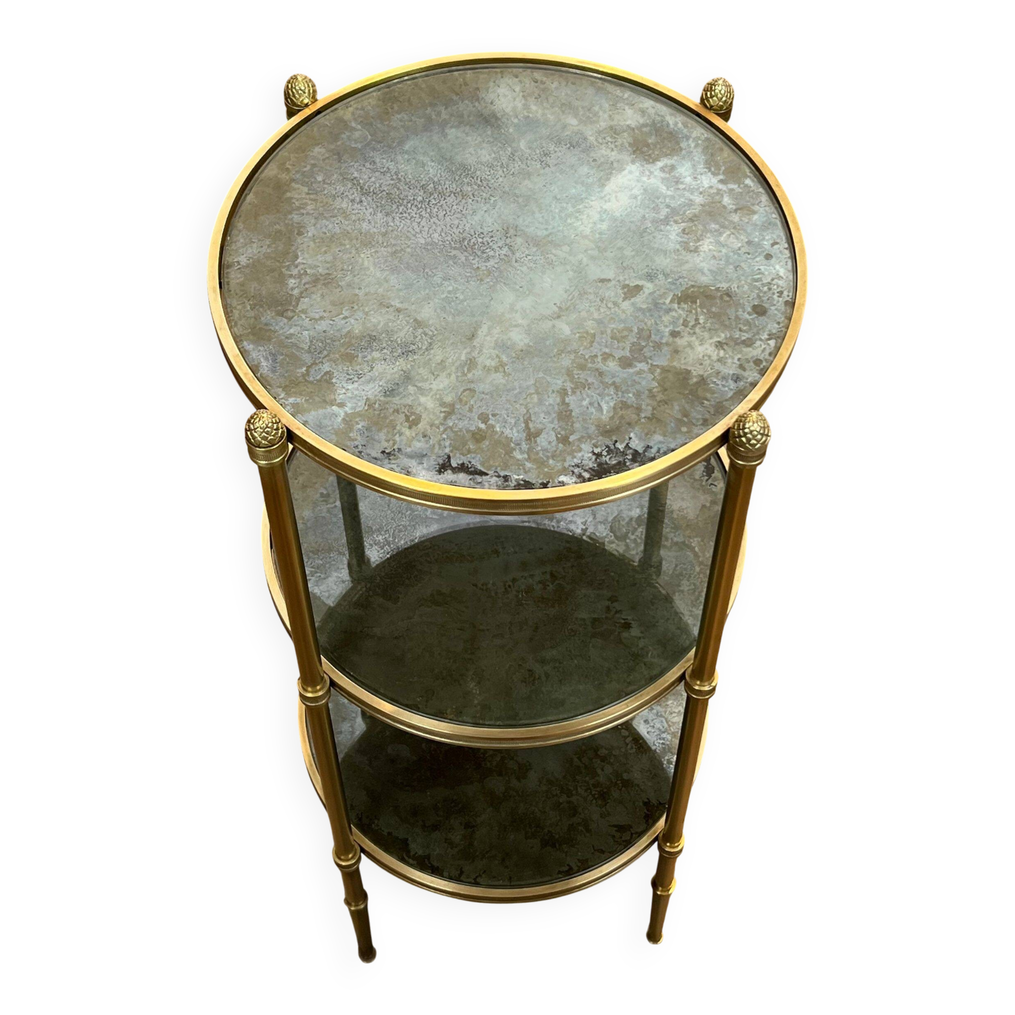 Round bronze side table with triple shelves of églomisé mirrors from Maison Baguès