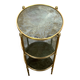 Round bronze side table with triple shelves of églomisé mirrors from Maison Baguès