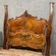 Center bed Louis XV rocaille of curved shape in walnut