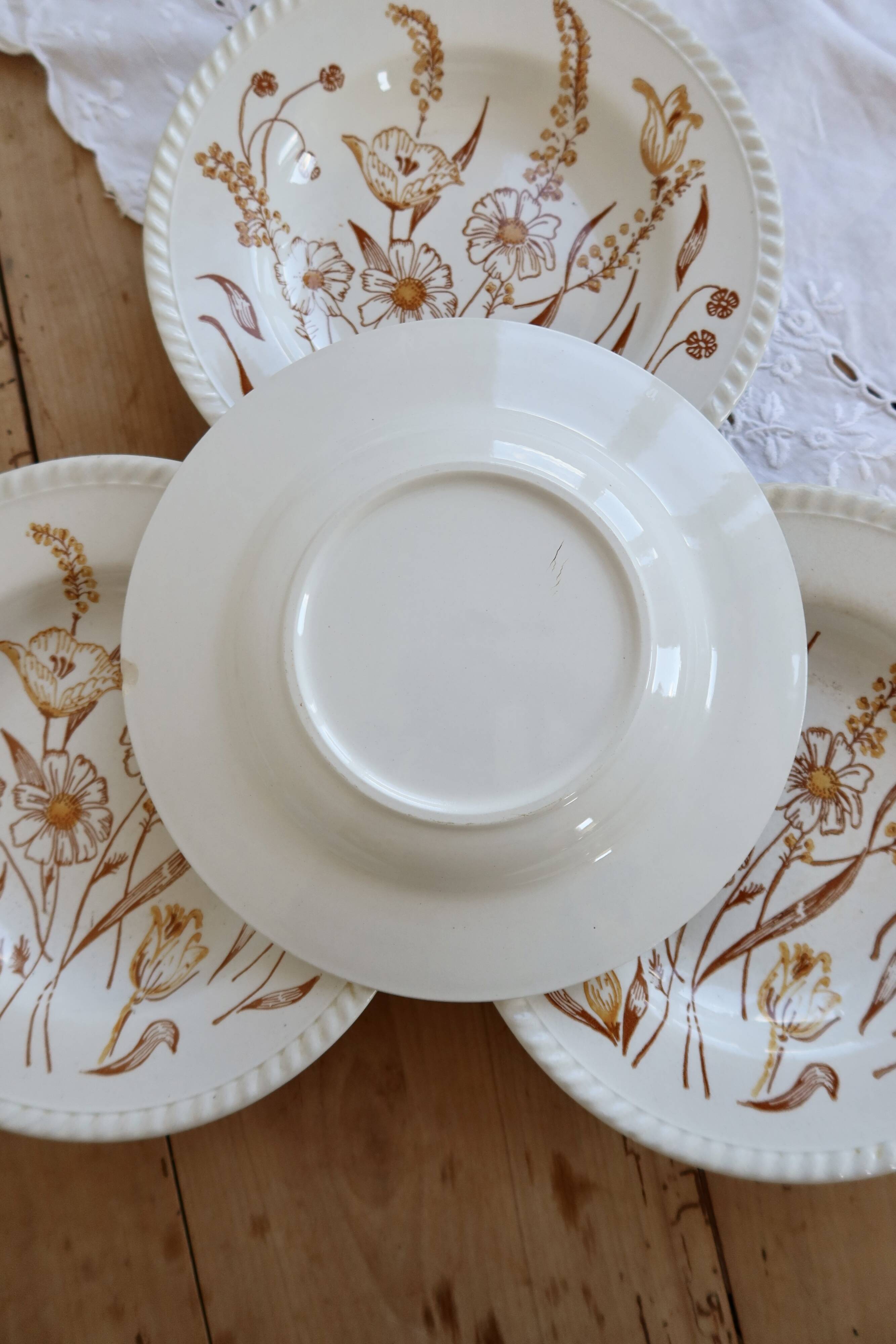 4 vintage deep plates with a brown floral design