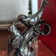 Zinc art bookends in the shape of birds on red marble - warblers