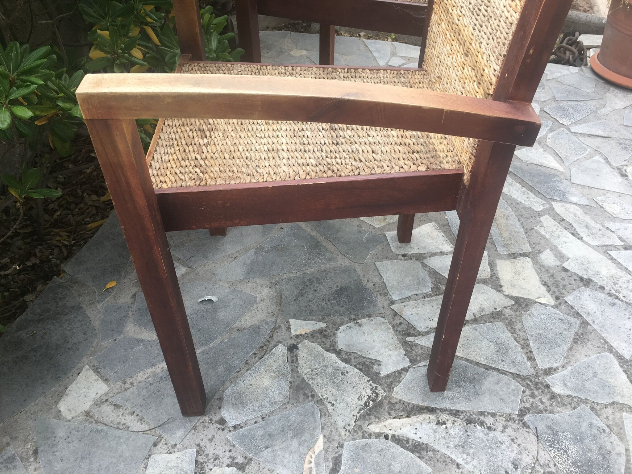 Pair of teak armchairs and braided wicker