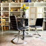 2 chairs in chromed metal and black woven skaï 1970s