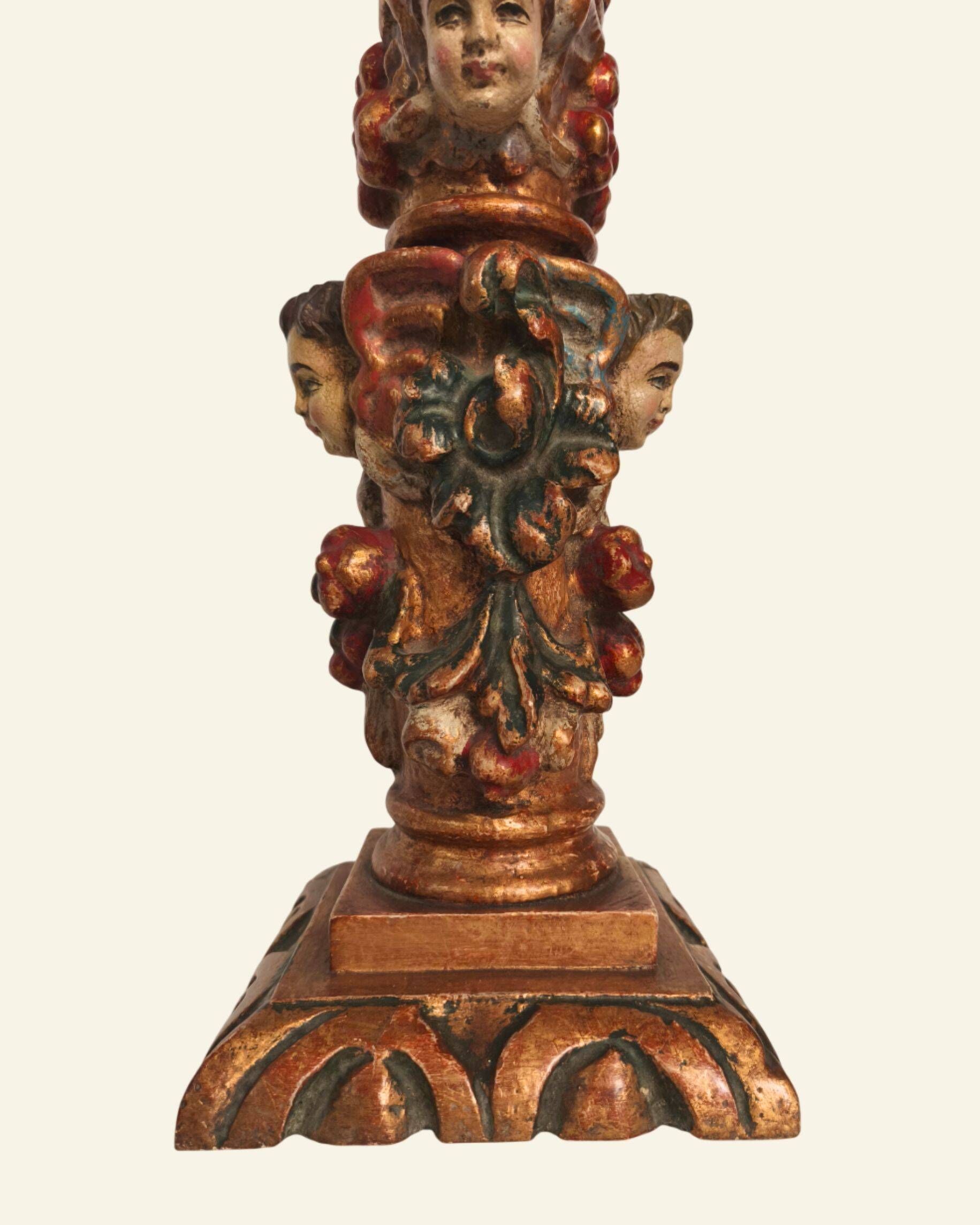 Renaissance table lamp in polychrome carved wood with cherubs.
