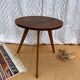 Pretty little vintage round table with tapered legs.