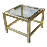 Small designer coffee table in gold metal