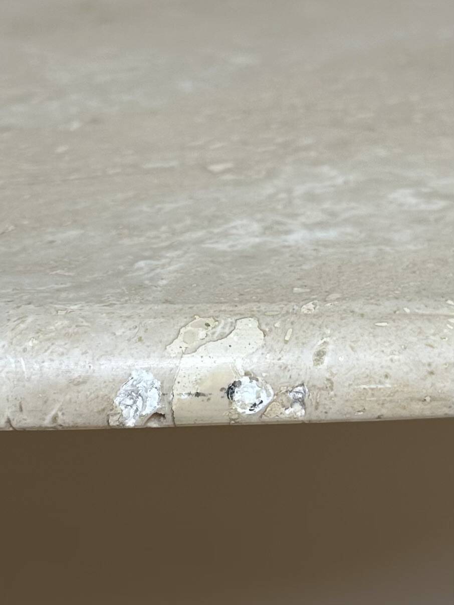 Travertine eye-shaped coffee table