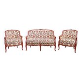 Antique salon with a banquette and Louis XV style bergère chairs.