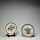 Two antique 18th-century faience plates, stapled.