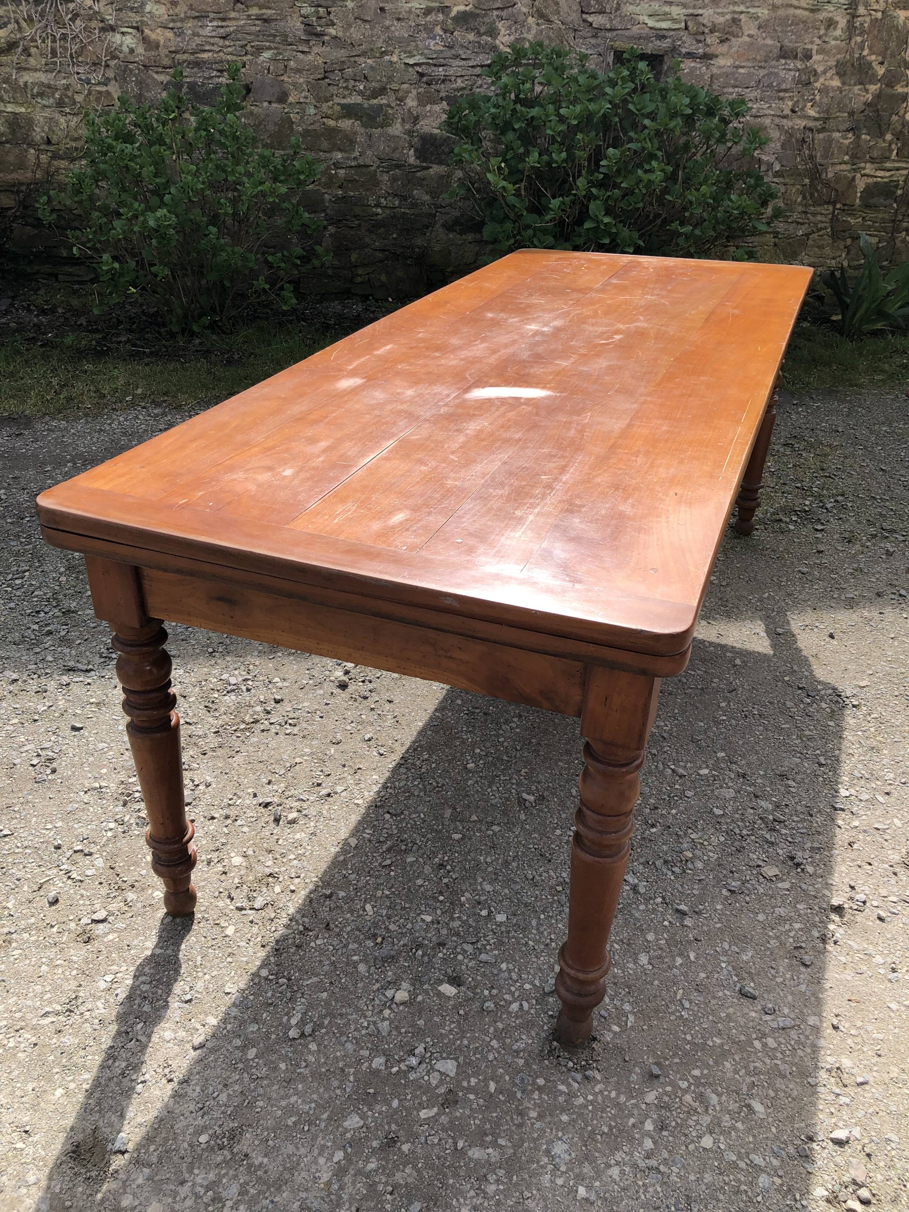 Antique Louis Philippe style farmhouse table in solid cherry wood with its 2 extensions.