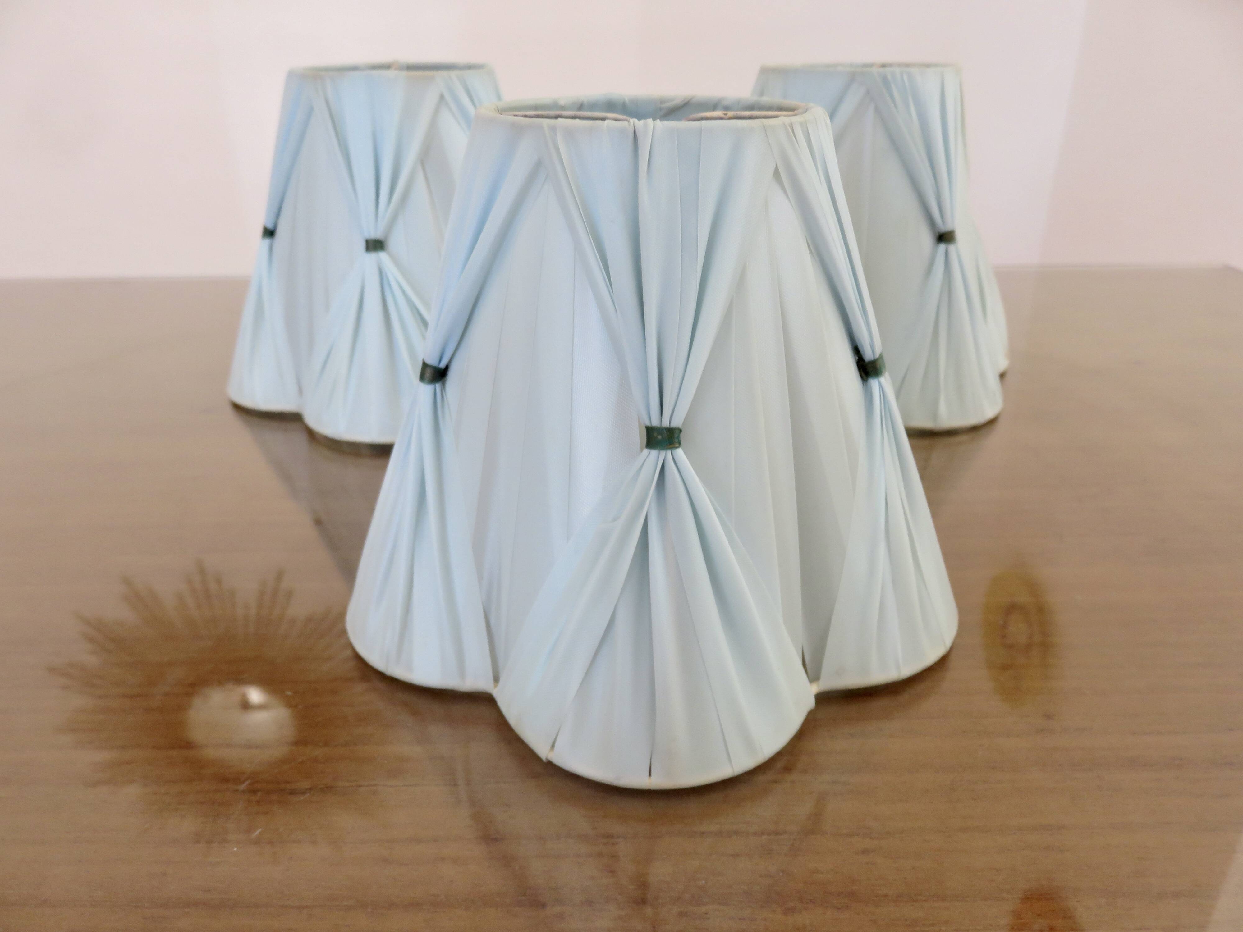 Set of 3 pale blue plastic strip lampshades, to clip onto a bulb.