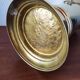 Vintage brass umbrella stand with lion decoration.
