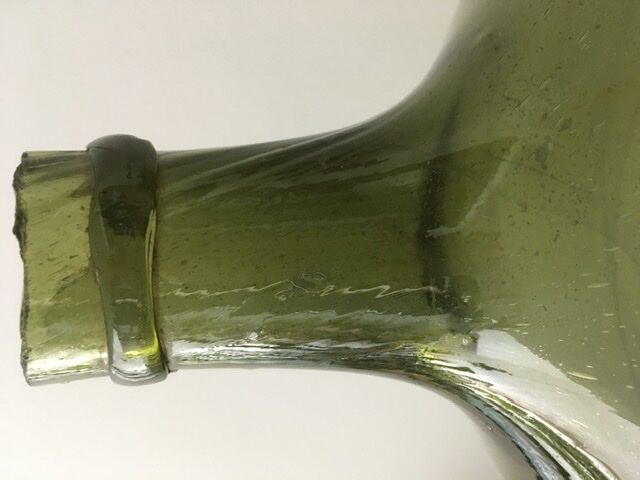 Old demijohn full of bubbles