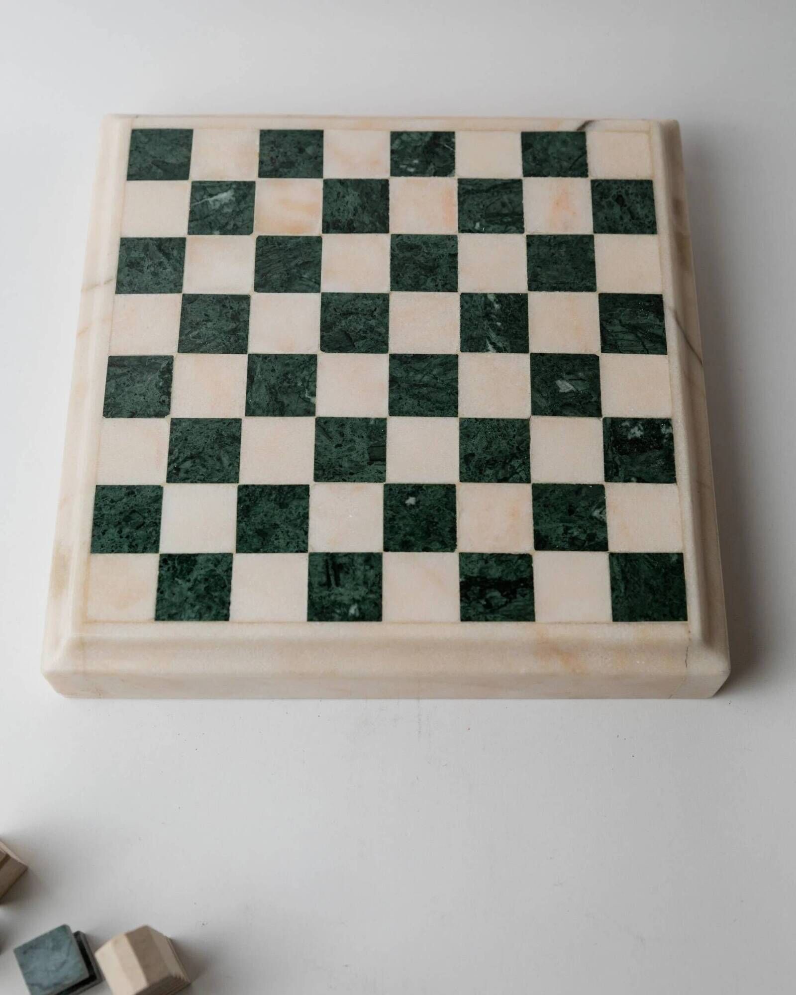 Vintage marble chess set from the 1970s, green and beige stone board, heavy design, geometric pieces, sculptural tabletop game, gift idea.