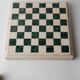 Vintage marble chess set from the 1970s, green and beige stone board, heavy design, geometric pieces, sculptural tabletop game, gift idea.