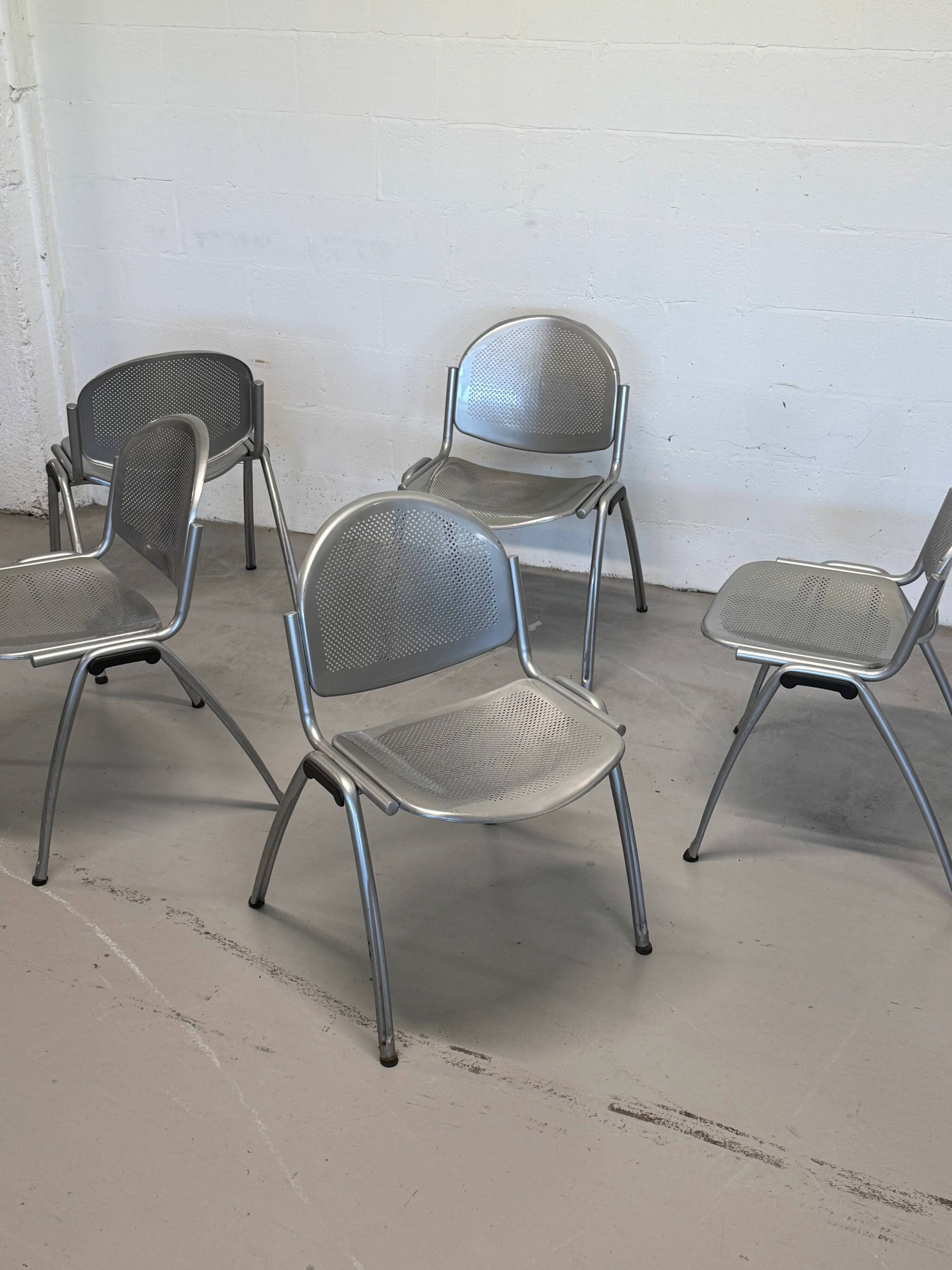 Vintage Sokoa stackable chairs, brutalist perforated metal chairs.