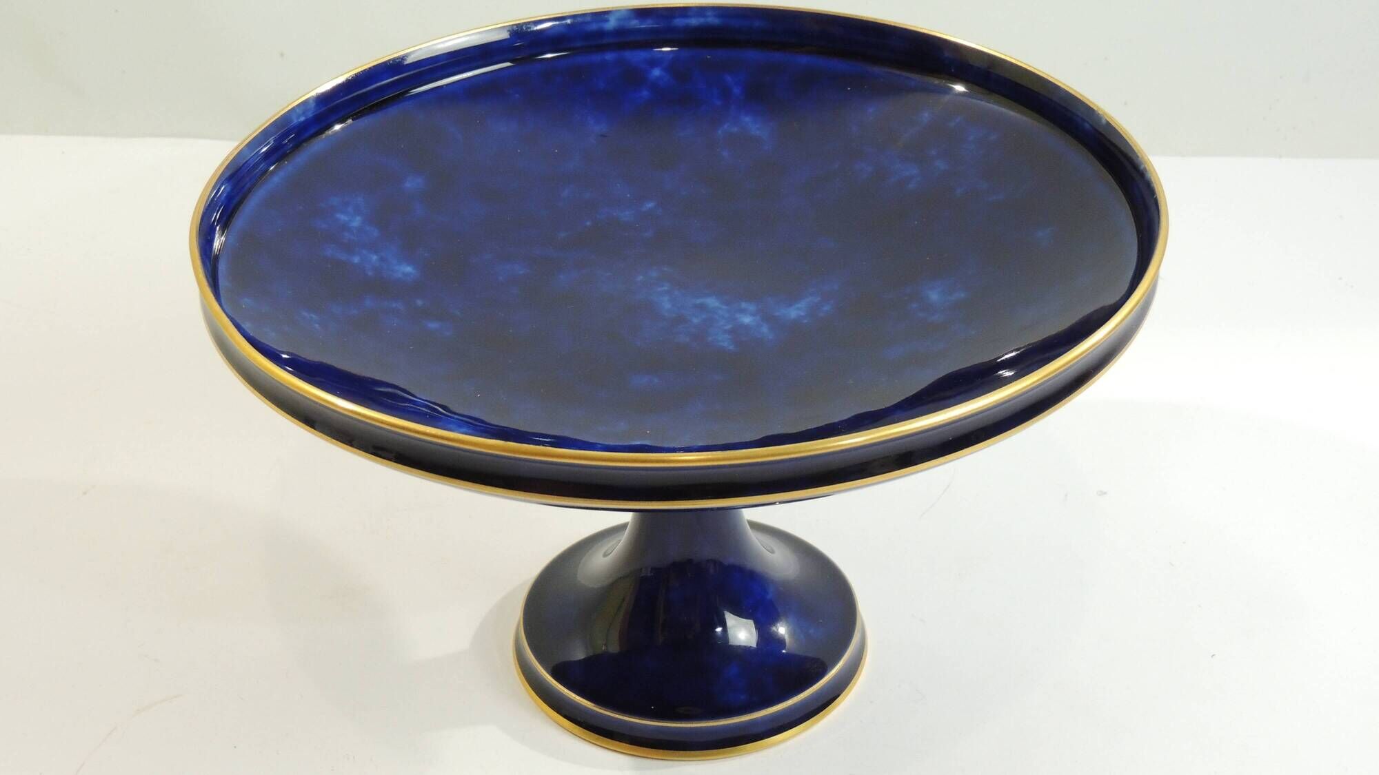 Sèvres porcelain cobalt blue footed bowl with gold rim – center