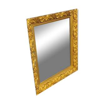 Wooden mirror decorated with gold from the 1920s