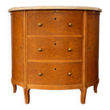 Half-moon commode in burl wood with a marble top.