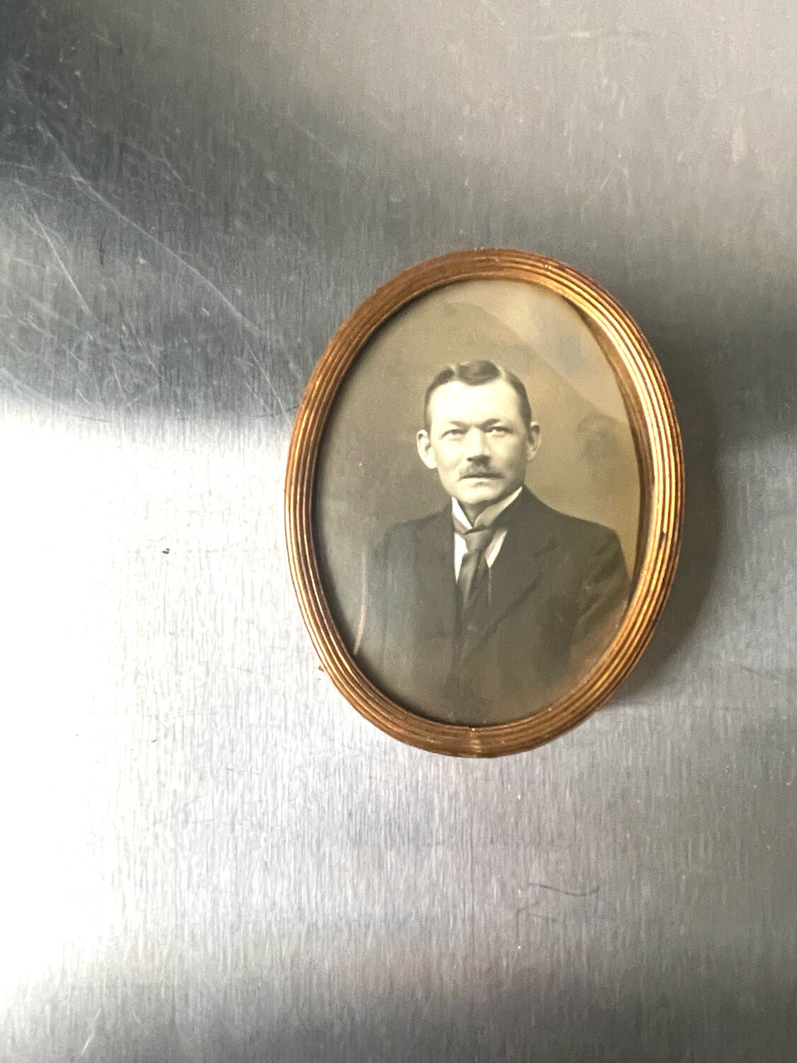 Metal gold colored oval picture frame brass