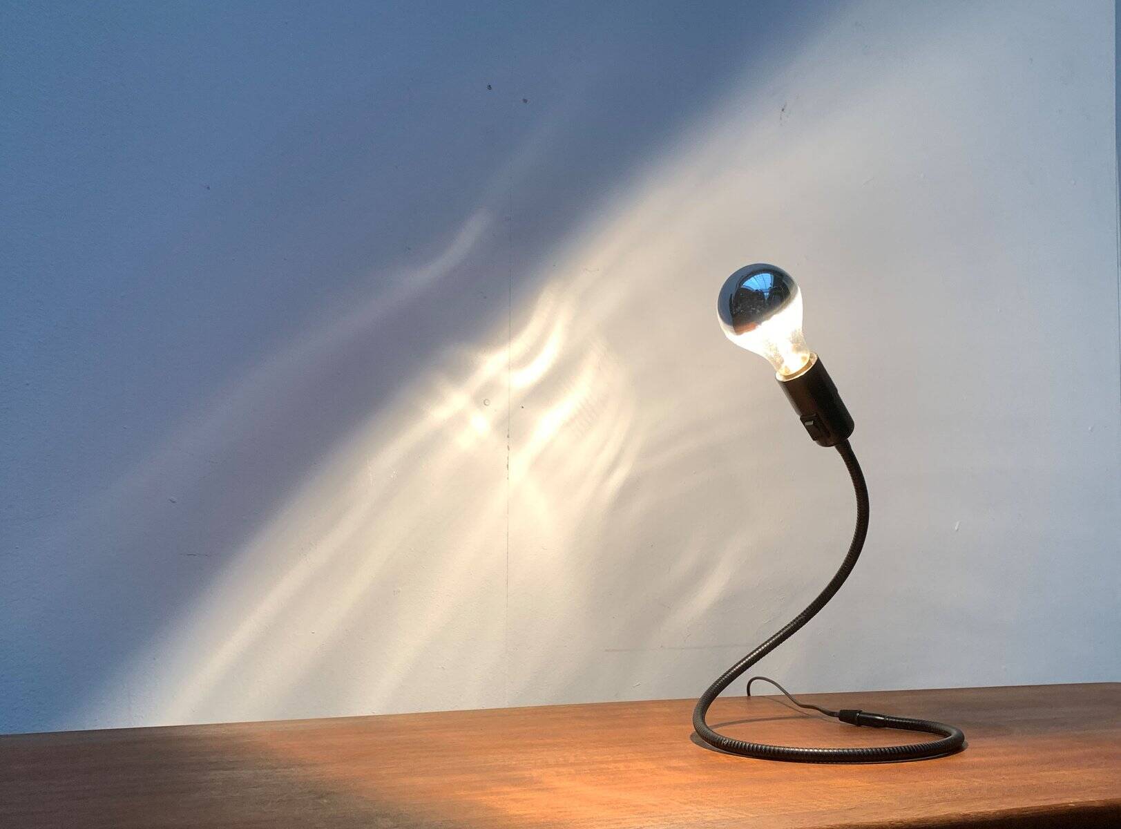 Lightworm minimalist table lamp by Walter Schnepel for Tecnolumen.