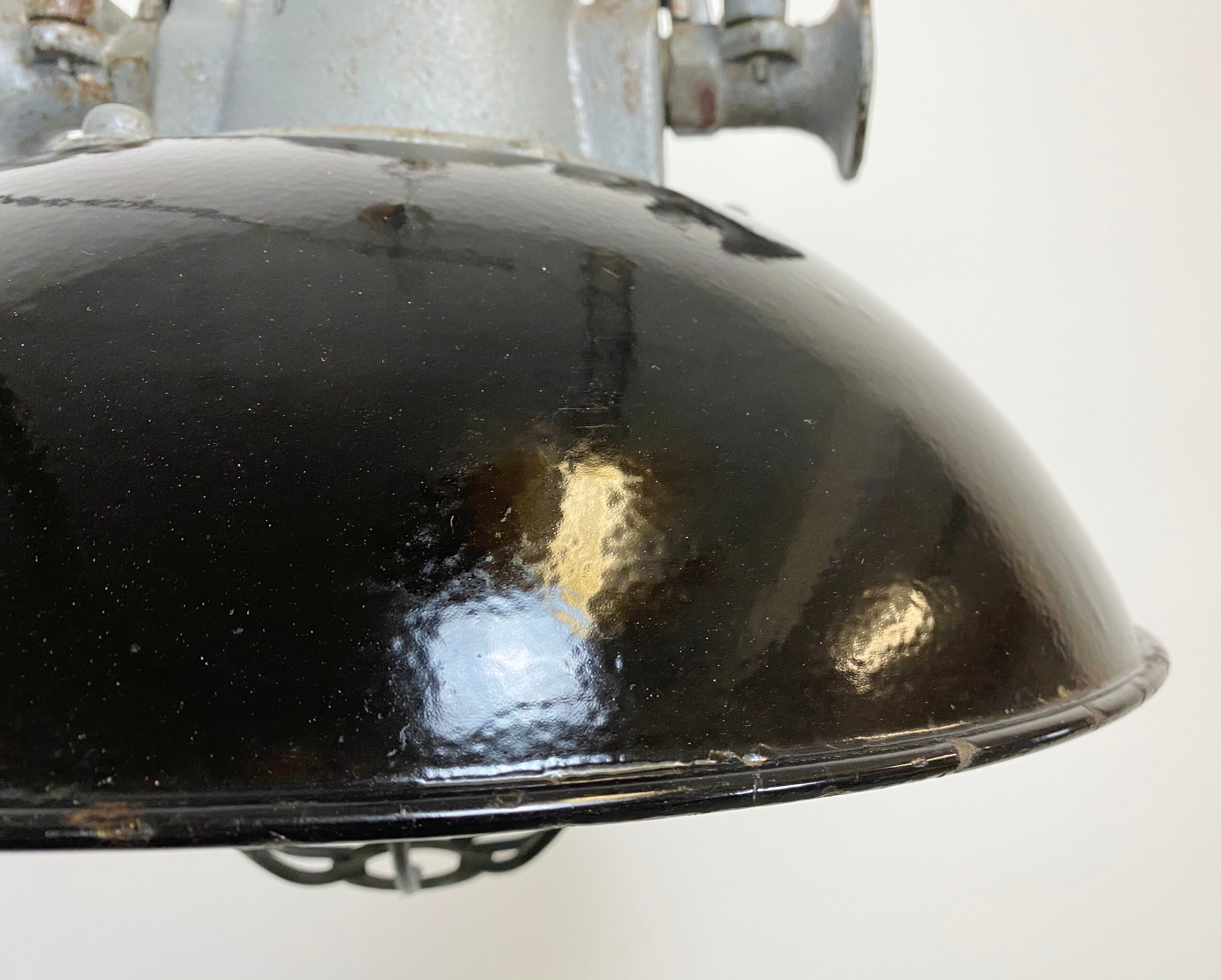 Black enamel and cast iron industrial cage pendant lamp, 1950
