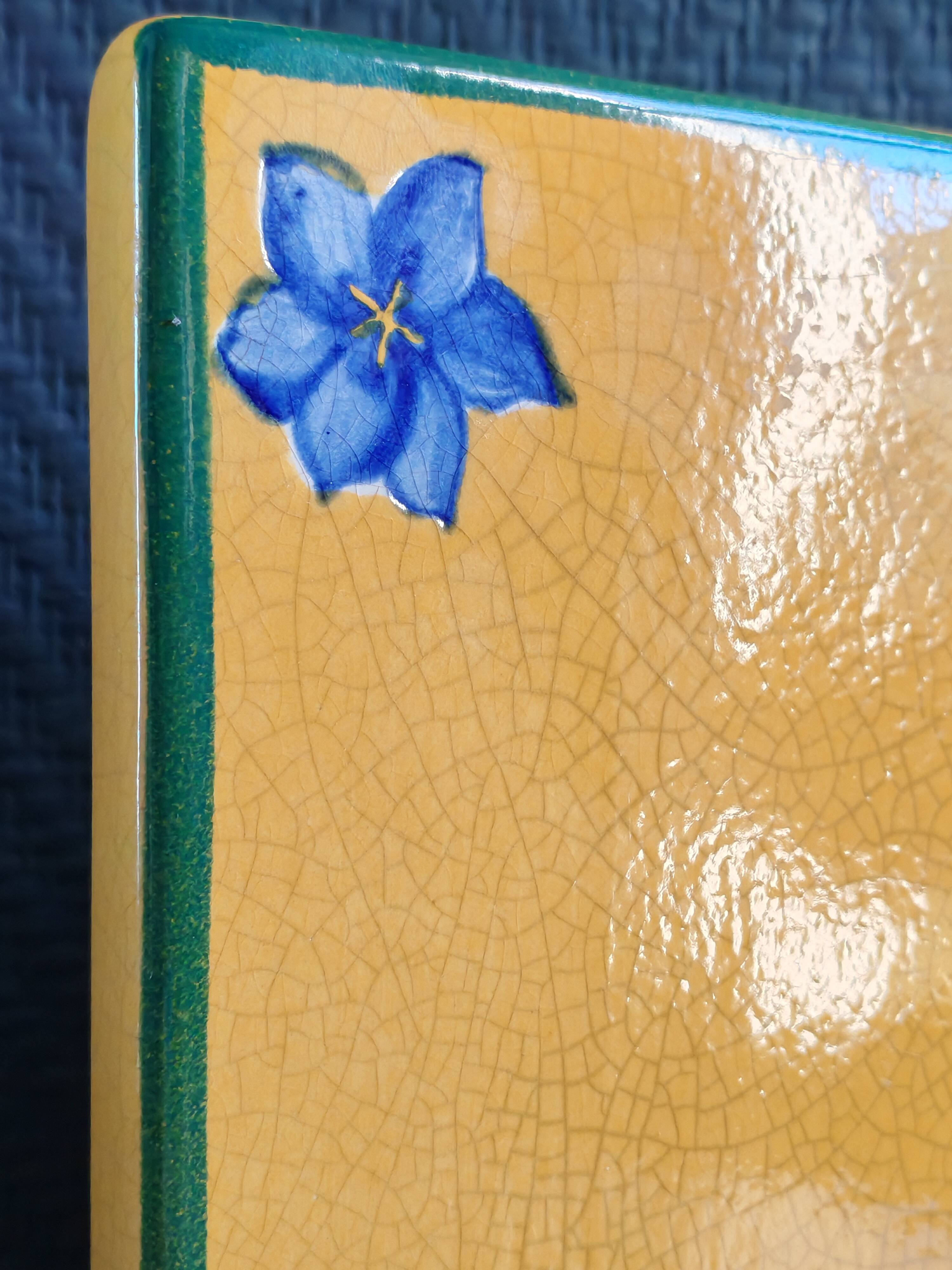 Yellow glazed ceramic trivet signed l. drimmer