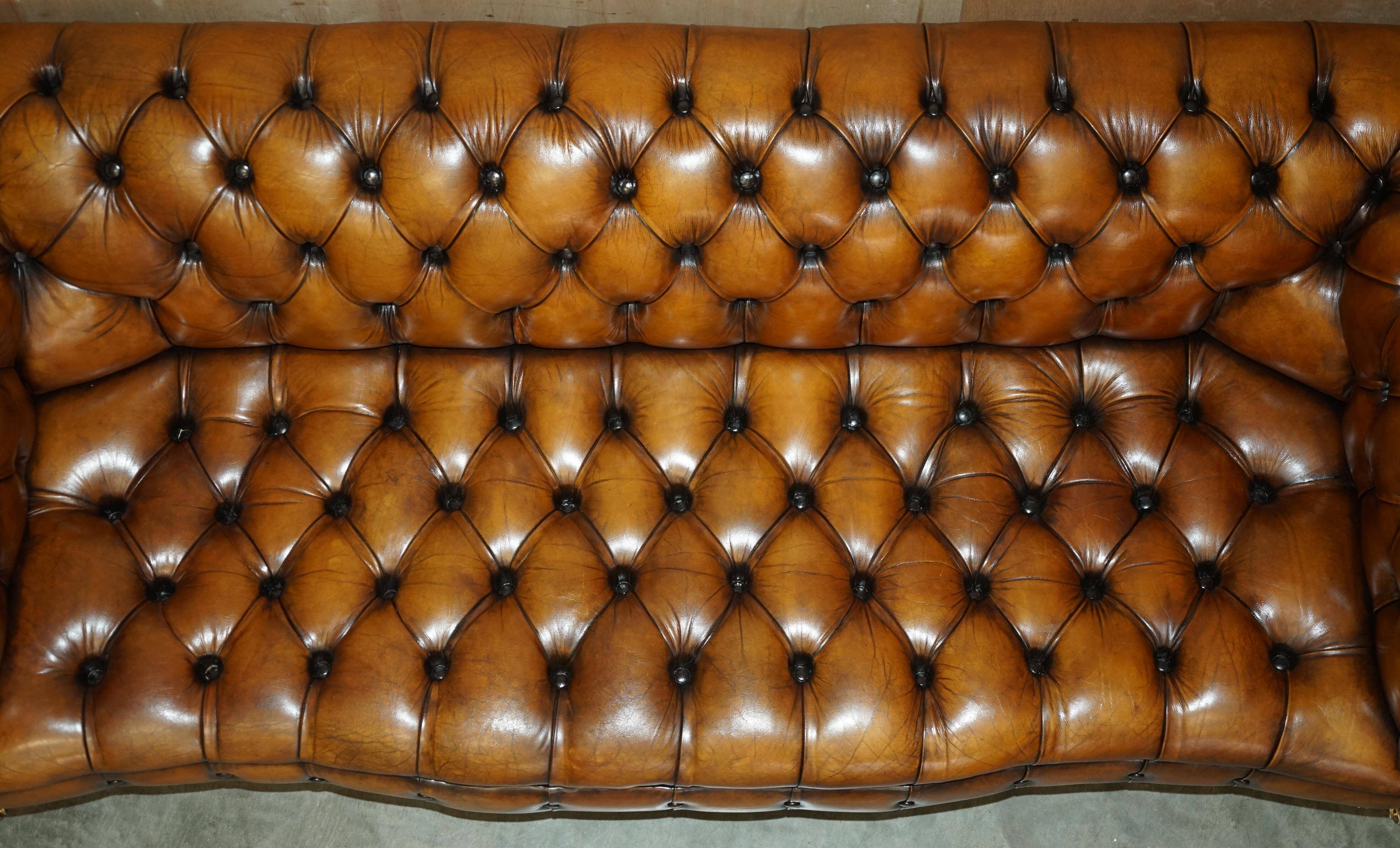 Vintage Chesterfield serpentine luxury sofa in restored leather