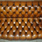 Vintage Chesterfield serpentine luxury sofa in restored leather