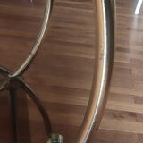 Service console with design / gilded metal wheels and smoked glass