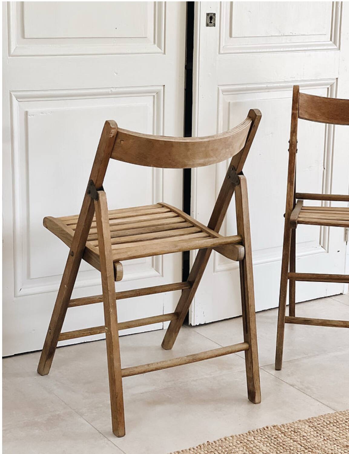 Pair of folding wooden chairs