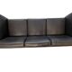 Black leather three-seater sofa
