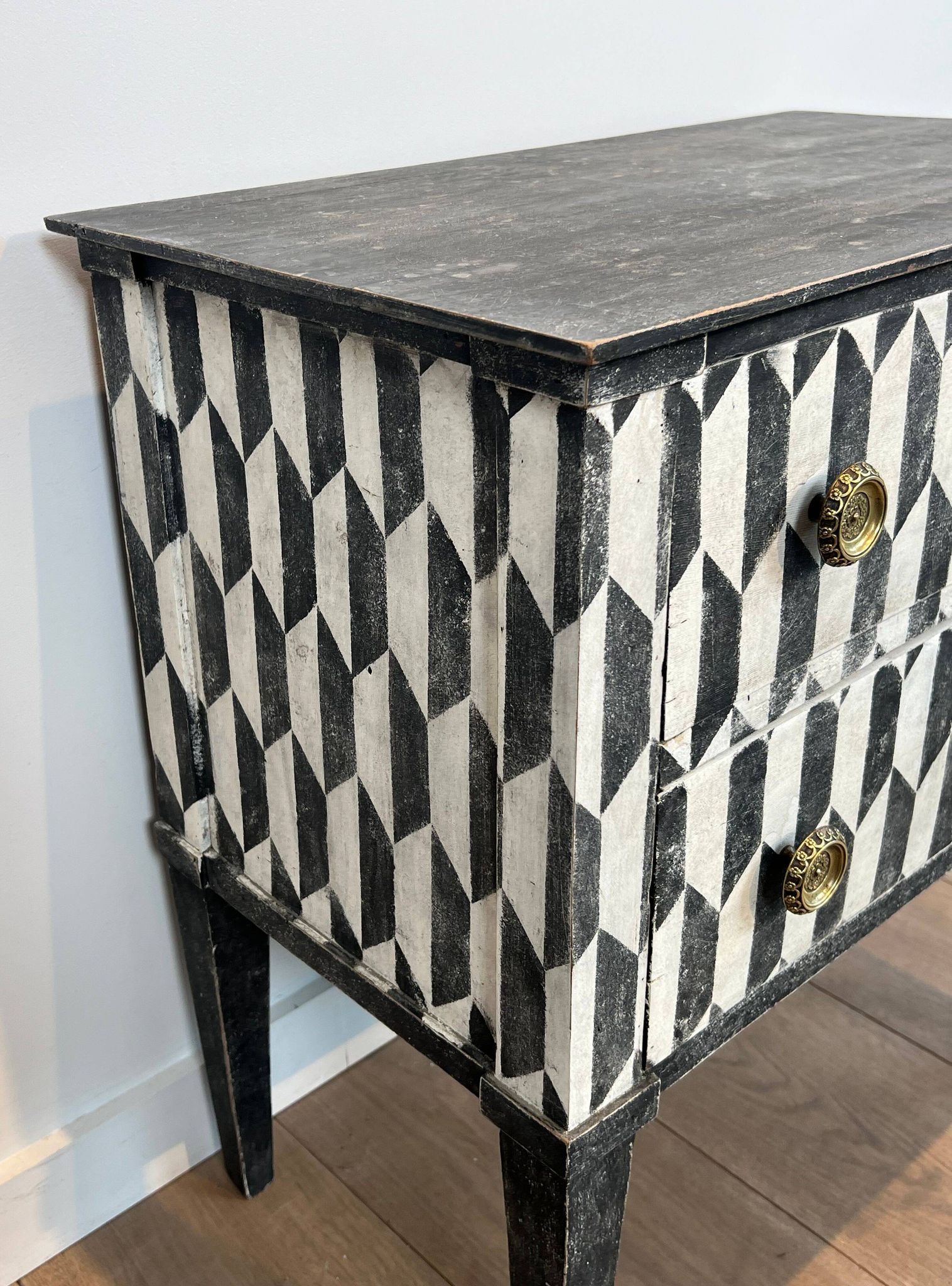 Small Italian chest of drawers with two drawers, patinated with a trompe-l'œil checkerboard pattern