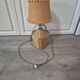 vintage table lamp dame jeanne covered in rattan wicker with a handle