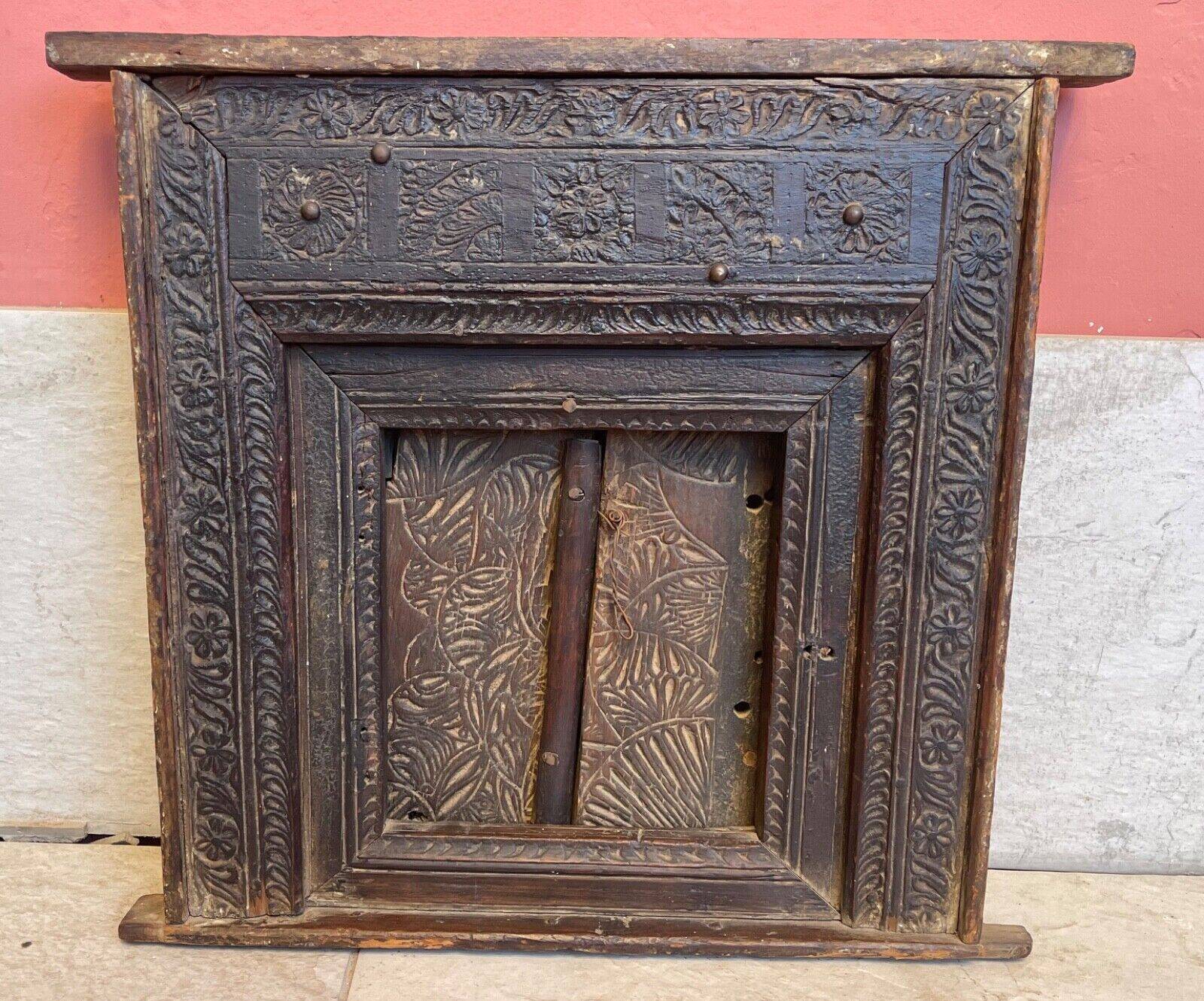 Old Indian window with carved decoration of flowers and foliage 19th century