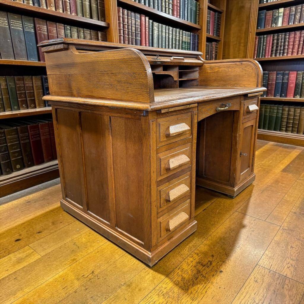 Vintage American desk made of solid wood with a curtain.