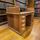 Vintage American desk made of solid wood with a curtain.