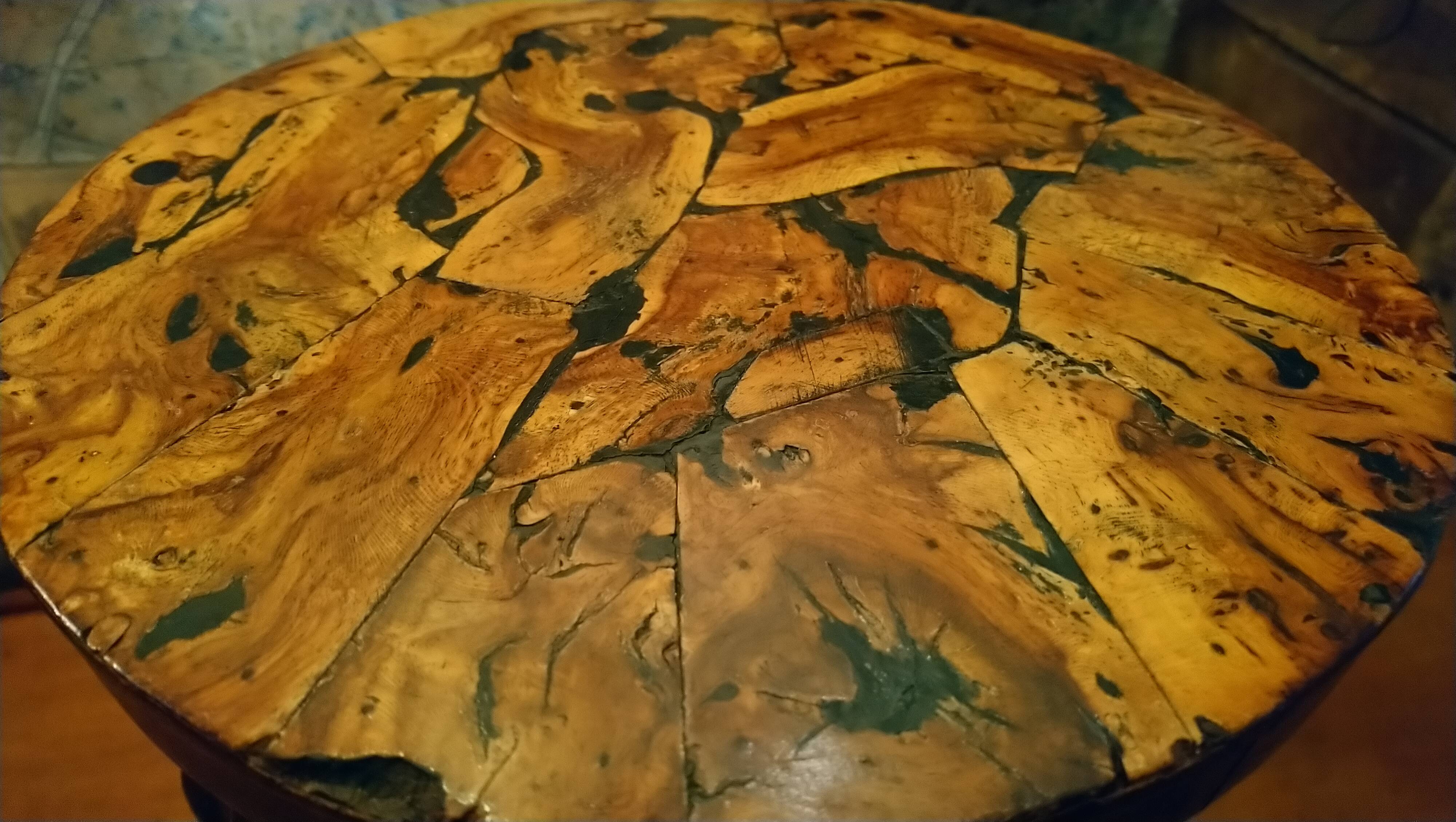 Brutalist tripod stool made from vine stumps.