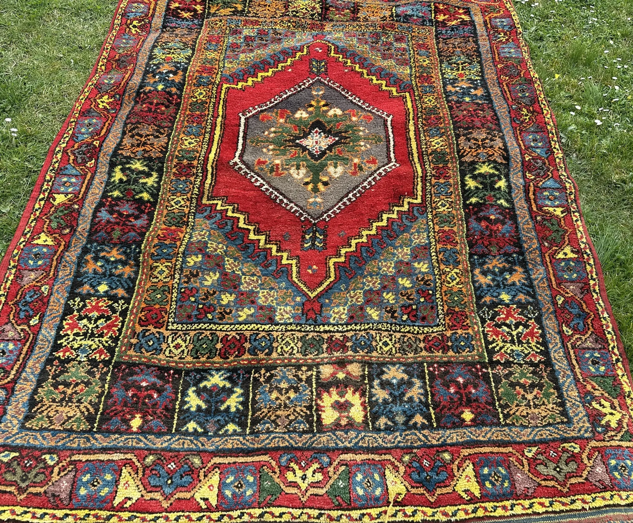 Old Moroccan carpet, made of natural wool and handwoven.
