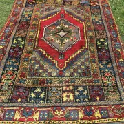 Old Moroccan carpet, made of natural wool and handwoven.