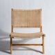 Reclining armchair in natural wood and woven rattan