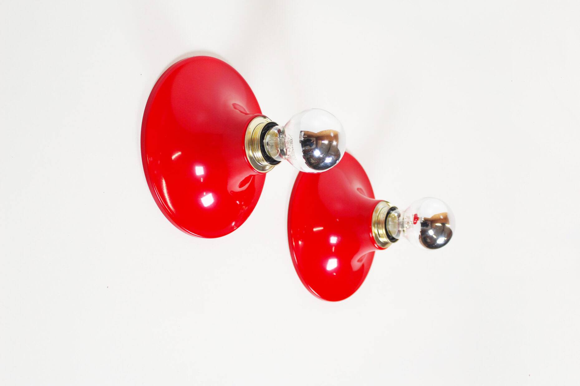 Pair of petite red disc sconces, Italy 1980s