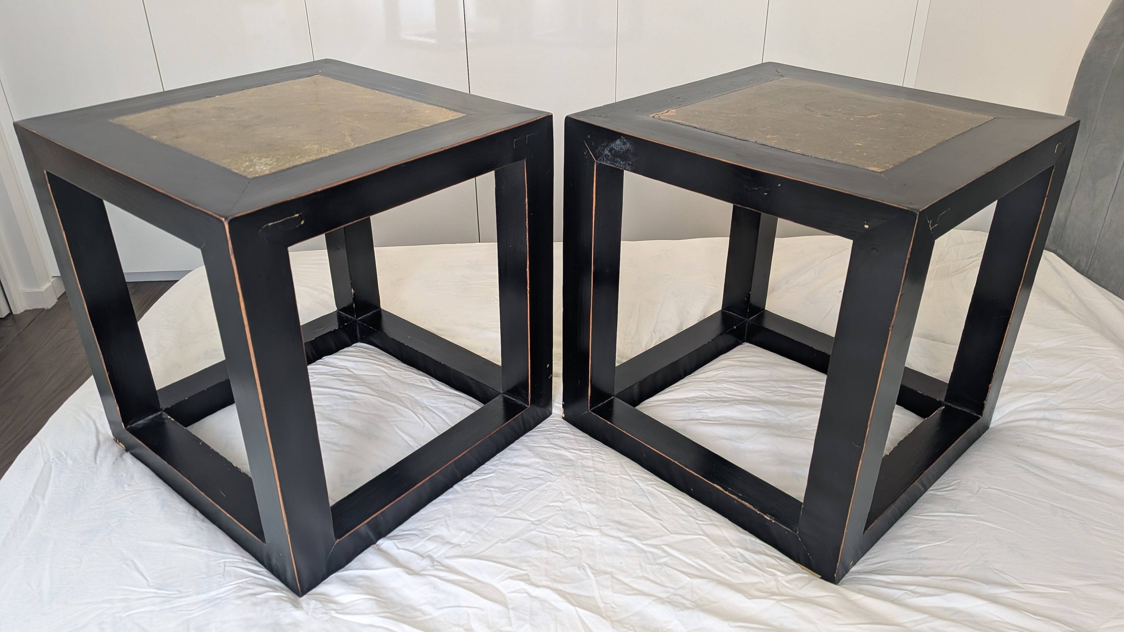 Chinese side tables in black lacquer, stone top.