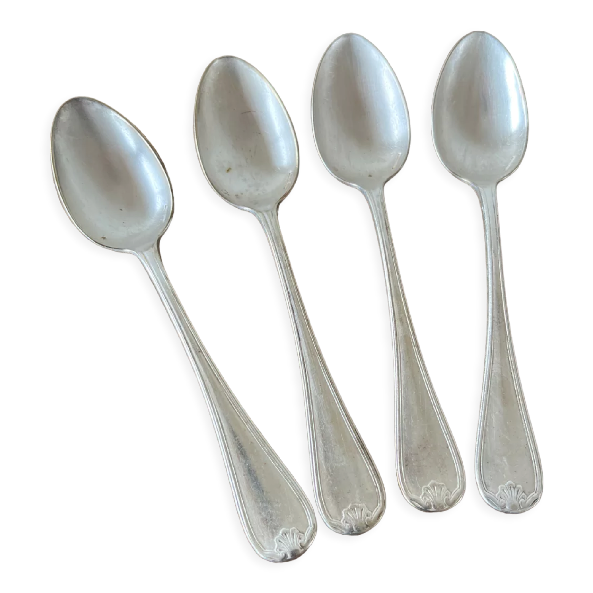 4 teaspoons in silver metal